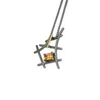 'Black and gold' small rutile formation pendant set with emerald cut citrine