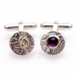 Patterned asymmetrical cufflinks made from tarnish resistant silver and brass and featuring an amethyst gemstone.