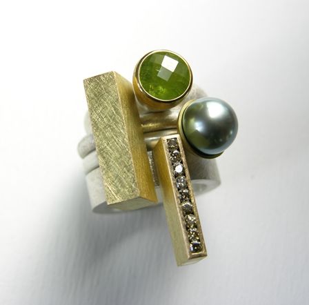Set of four rings in silver, 18 & 22ct gold, tourmaline, natural-green diamonds and tahitian pearl.